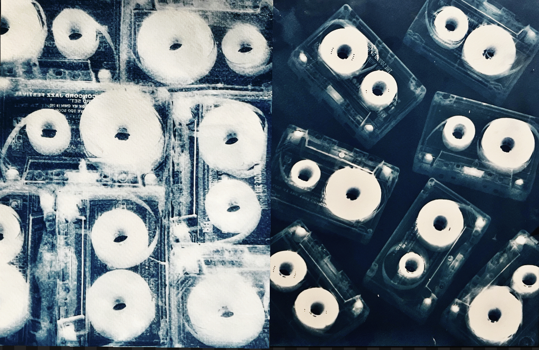 Blue-toned photographic composition of cassette tapes arranged in a grid pattern, highlighting the circular reels and creating a rhythmic visual pattern with high contrast between white circles and deep blue background.